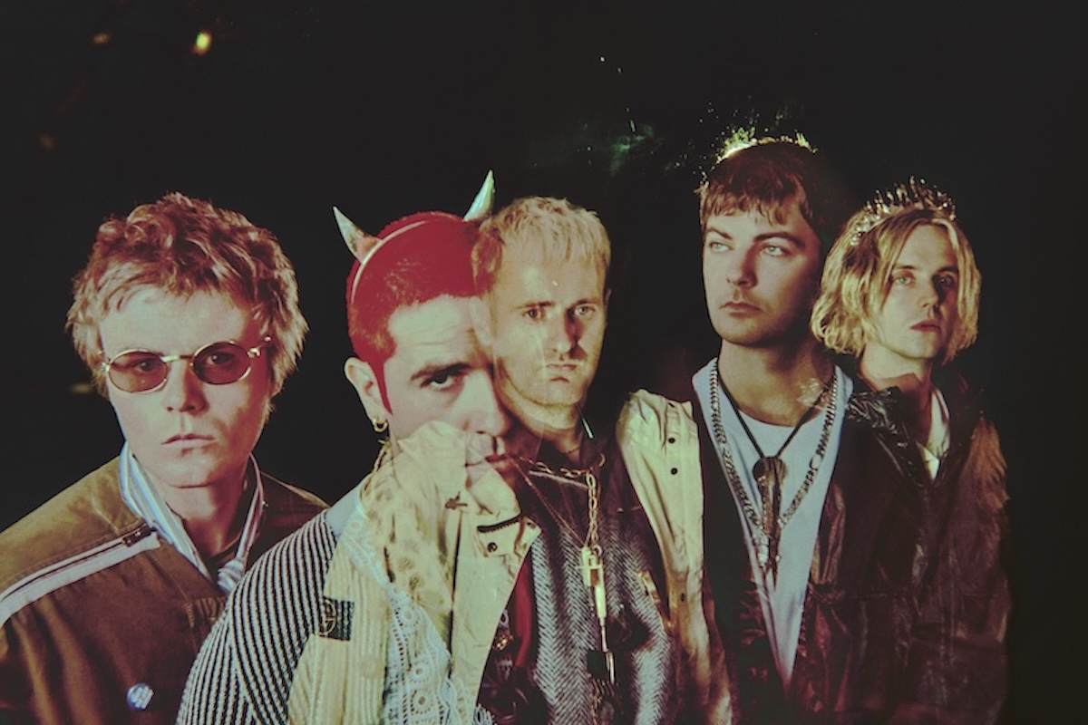 Post-punk band Fontaines D.C. in an avant-garde portrait featuring devil horns and a tiara, photo by Elizaveta Porodina.